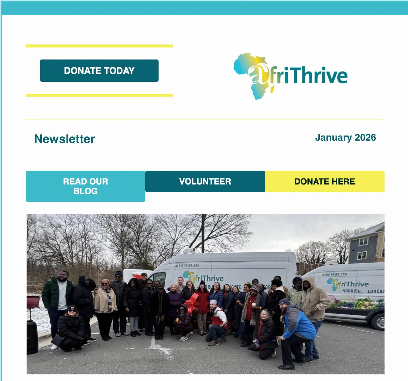 Large group of AfriThrive volunteers and staff gathered in a snowy parking lot in front of two white AfriThrive mobile food pantry vans. The diverse group of approximately 25-30 people, dressed in winter coats, stands together smiling at the camera. The vans display the AfriThrive logo featuring the African continent and text reading 'NOURISH. EDUCATE. EMPOWER.' The scene captures a community food distribution event on a winter day with bare trees visible in the background.